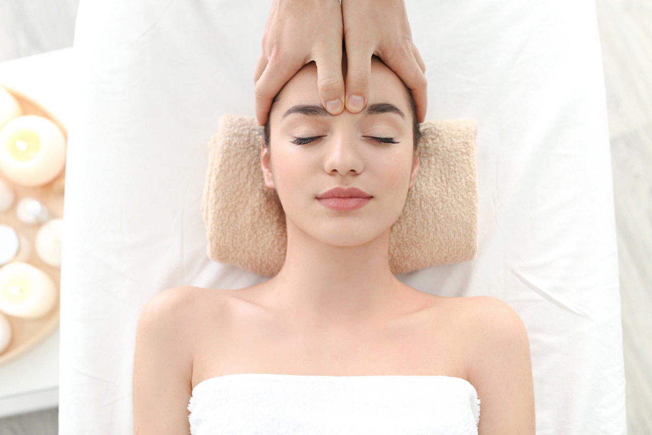 Esthetician performing facial massage