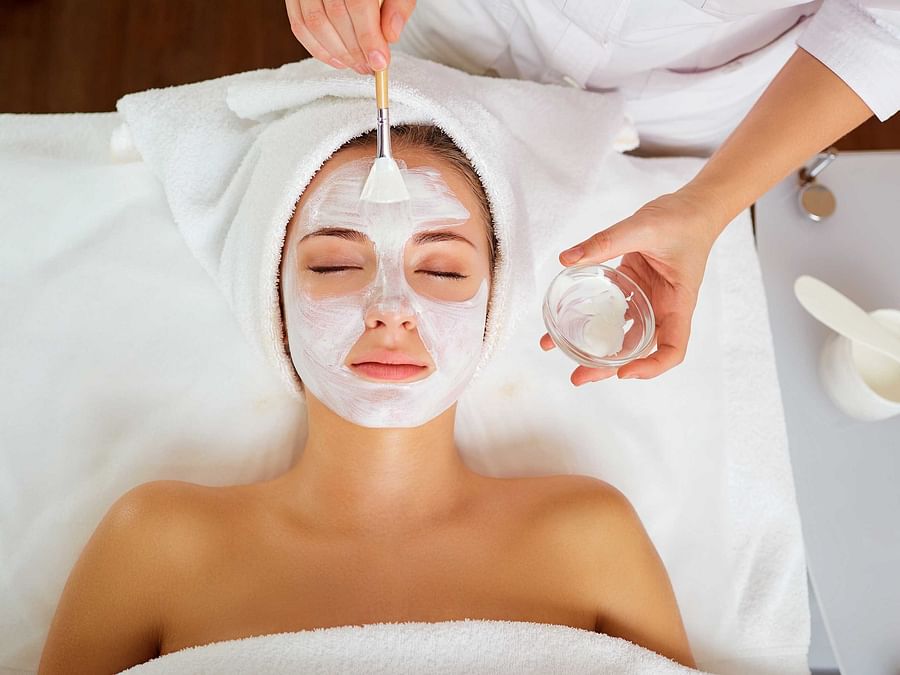 Esthetician performing careful extractions